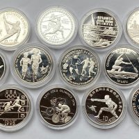 Ulike land OL Atlanta 12 stk. sølv mynter, 320,75 g rent sølv, proof
